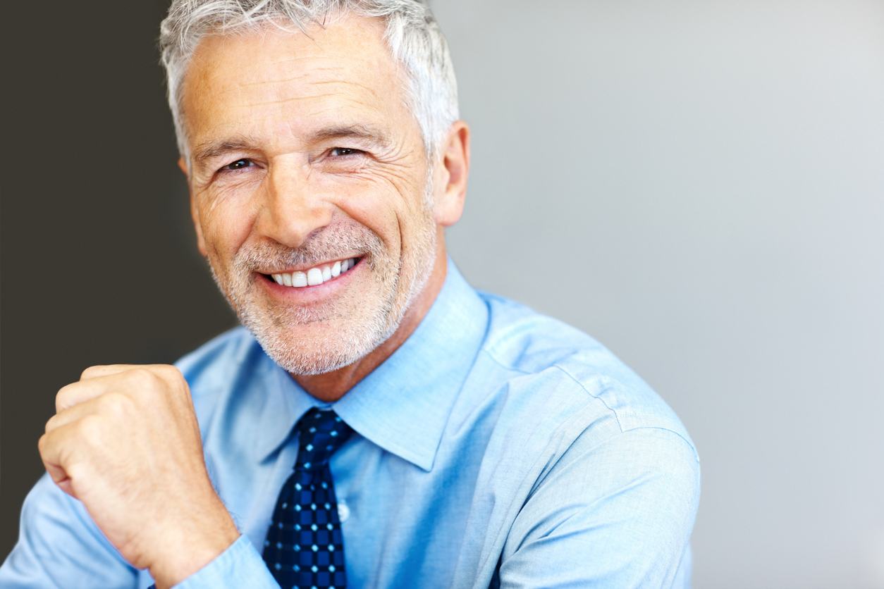 Successful mature business man smiling - Copyspace